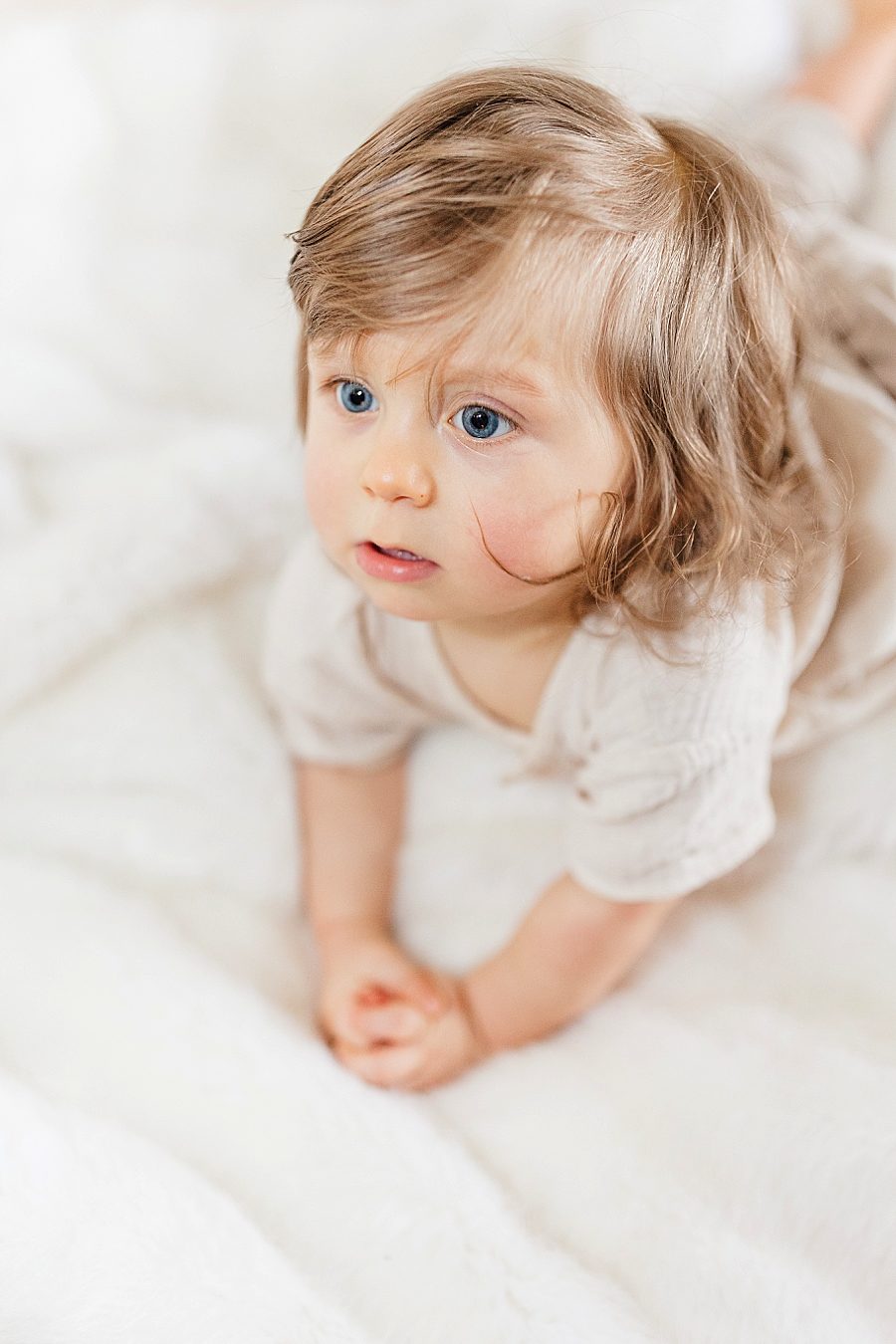 Baby on the bed 12 month lifestyle session