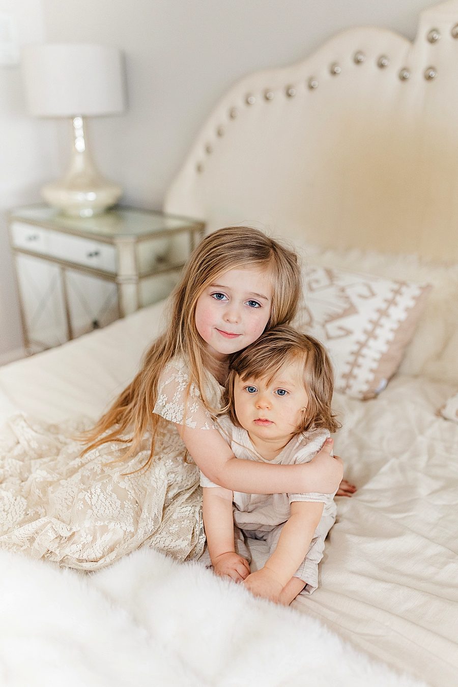 Sister hugging brother 12 month lifestyle session