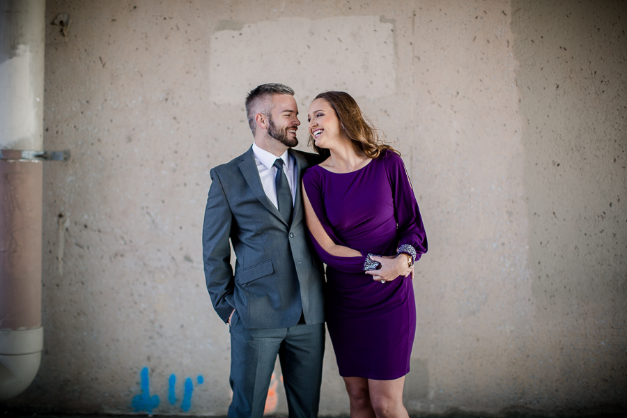 His arm around her waste engagement photo by Knoxville Wedding Photographer, Amanda May Photos.