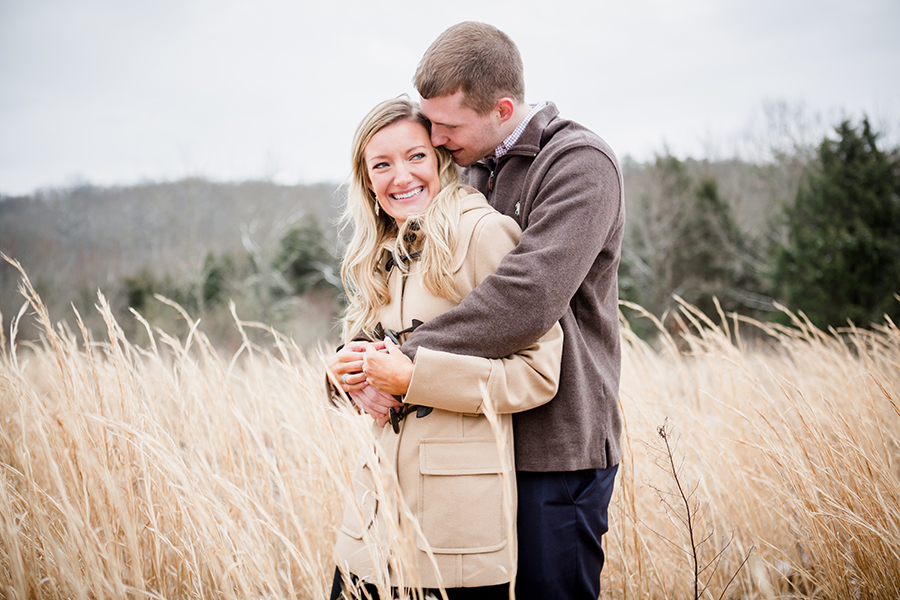 Standing in the hay engagement photo by Knoxville Wedding Photographer, Amanda May Photos.