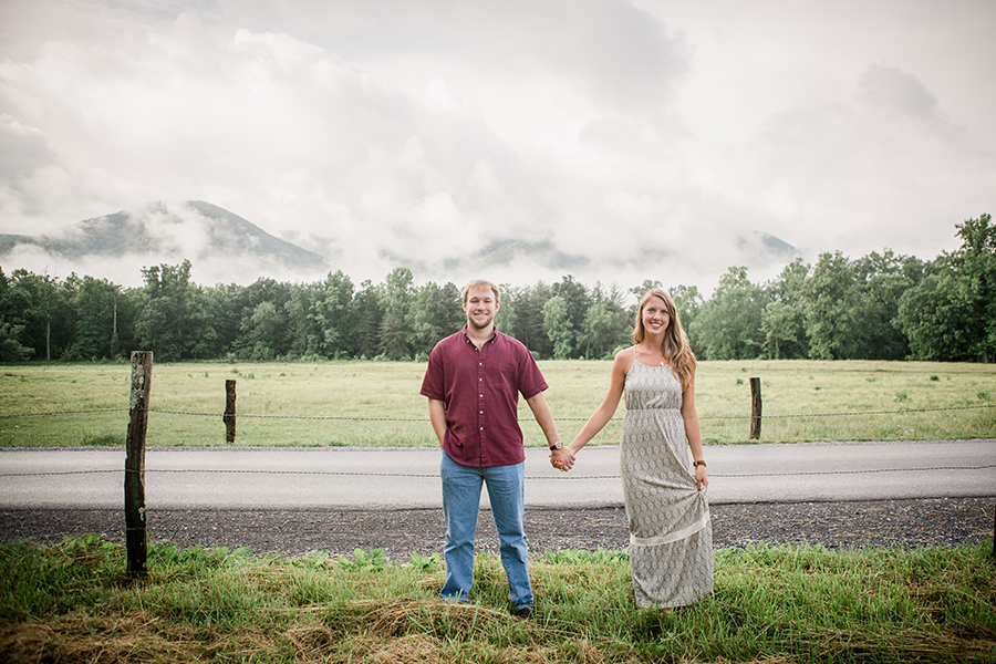 Standing in front of the foggy mountains engagement photo by Knoxville Wedding Photographer, Amanda May Photos.