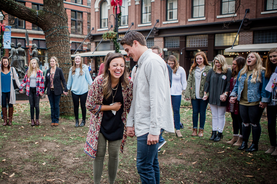 Laughing in a circle of friends engagement photo by Knoxville Wedding Photographer, Amanda May Photos.