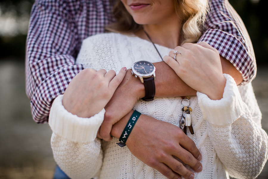 Snuggly arms with WWJD bracelet engagement photo by Knoxville Wedding Photographer, Amanda May Photos.