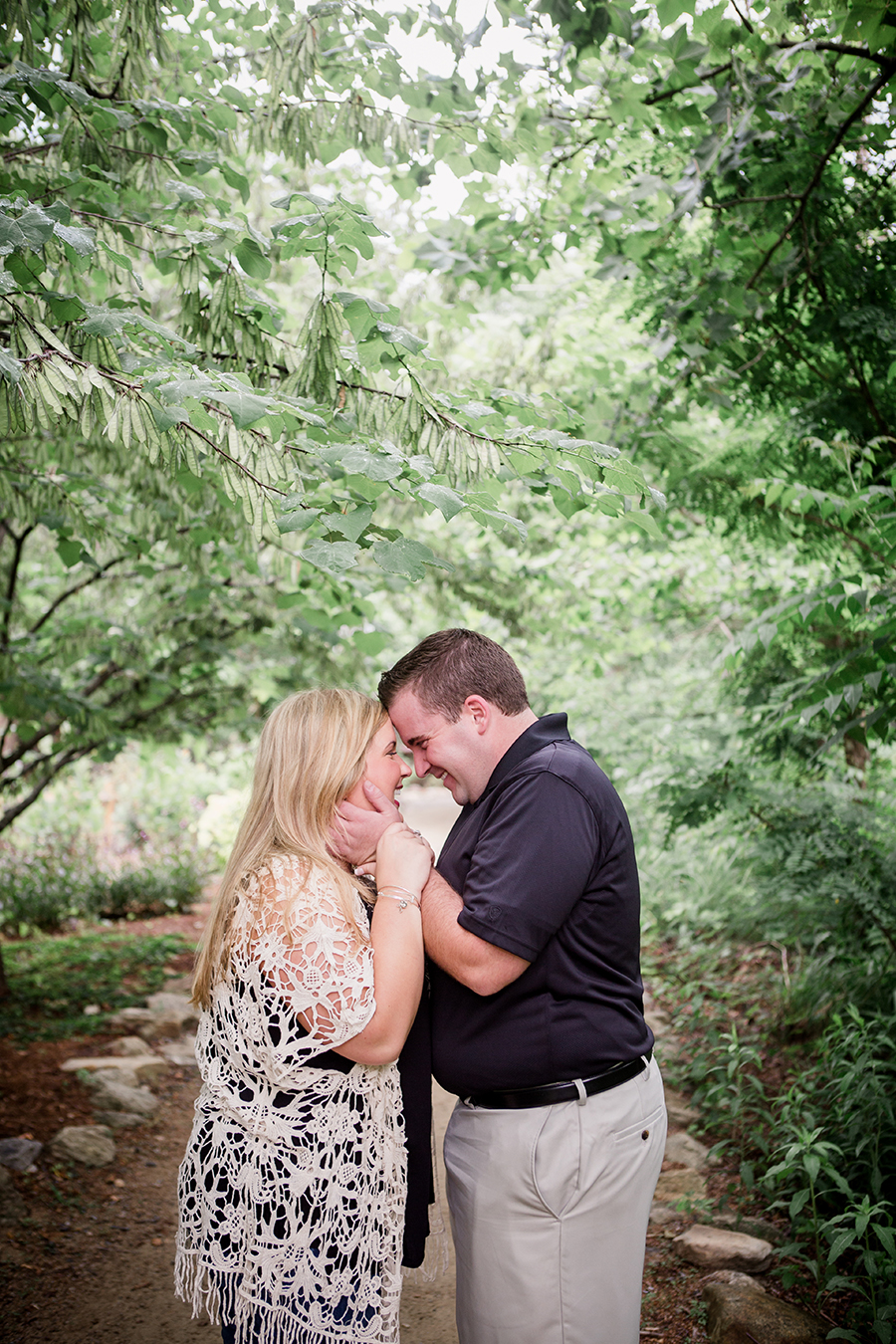 Pulling her close engagement photo by Knoxville Wedding Photographer, Amanda May Photos.