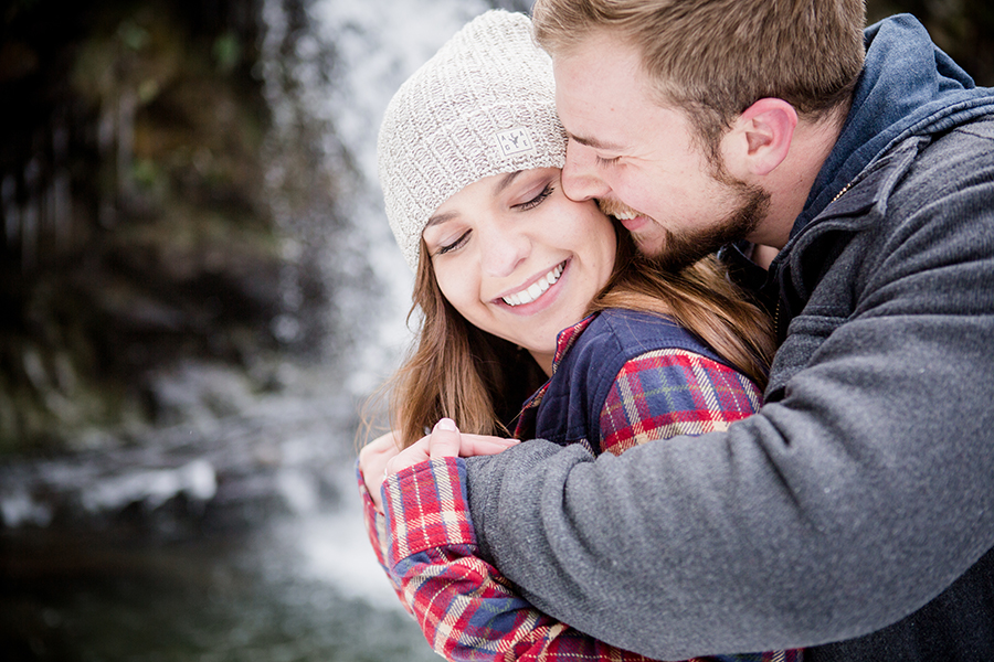 His smile against her cheek engagement photo by Knoxville Wedding Photographer, Amanda May Photos.
