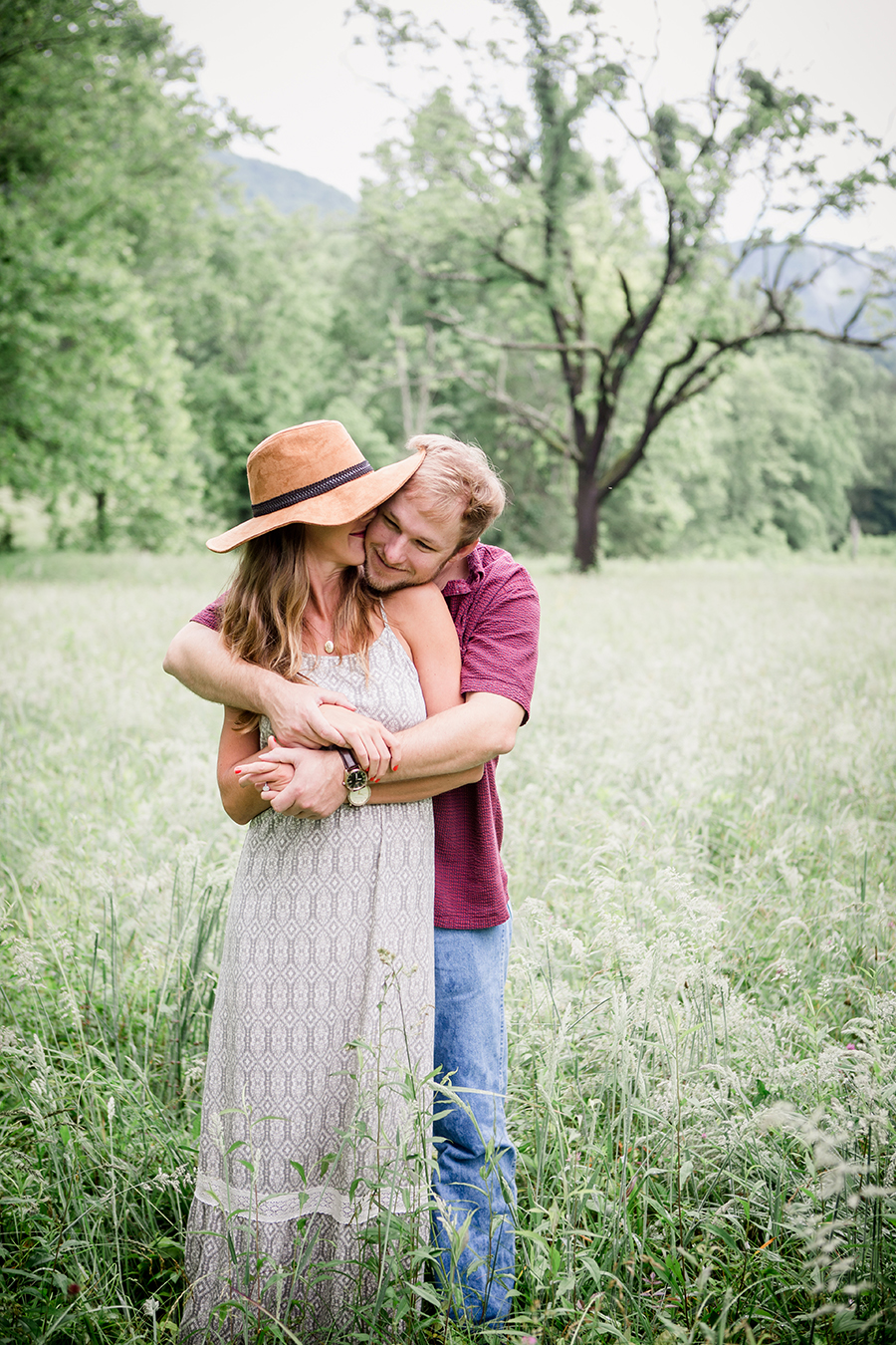 His arms around her body engagement photo by Knoxville Wedding Photographer, Amanda May Photos.
