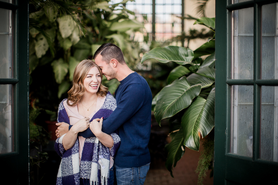 His arms around her shoulders engagement photo by Knoxville Wedding Photographer, Amanda May Photos.