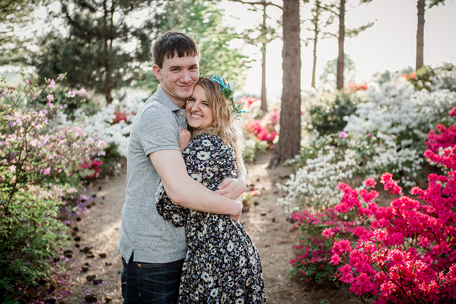 Wrapping her up in his arms engagement photo by Knoxville Wedding Photographer, Amanda May Photos.
