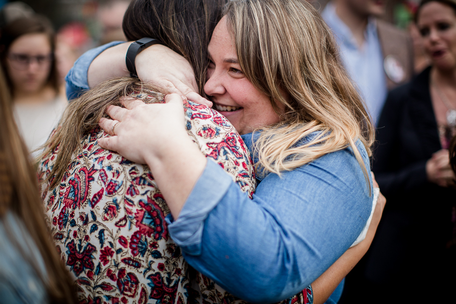 Her friends hug her tight engagement photo by Knoxville Wedding Photographer, Amanda May Photos.