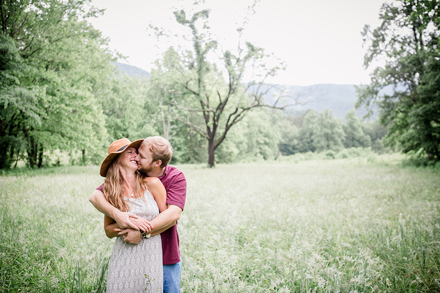Kisses from behind engagement photo by Knoxville Wedding Photographer, Amanda May Photos.