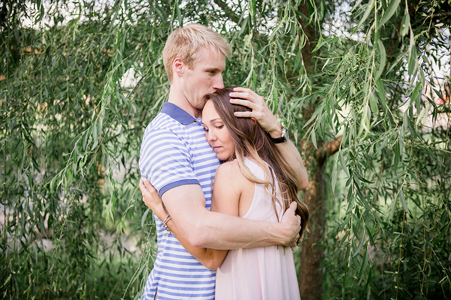 He squeeze her against him engagement photo by Knoxville Wedding Photographer, Amanda May Photos.