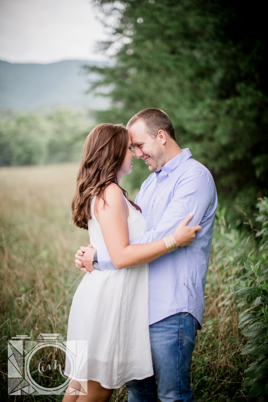 Foreheads together at cades cove engagement photo by Knoxville Wedding Photographer, Amanda May Photos.