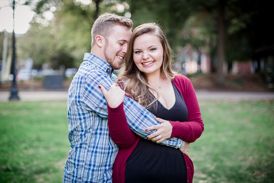 His arms wrapped around her waste engagement photo by Knoxville Wedding Photographer, Amanda May Photos.