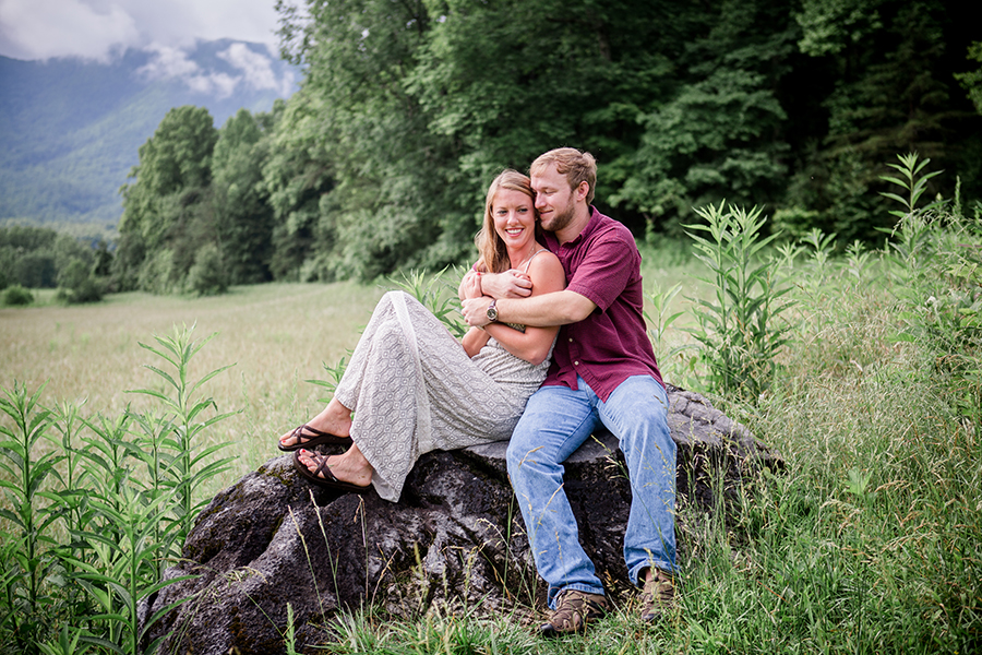 Sitting on a rock engagement photo by Knoxville Wedding Photographer, Amanda May Photos.