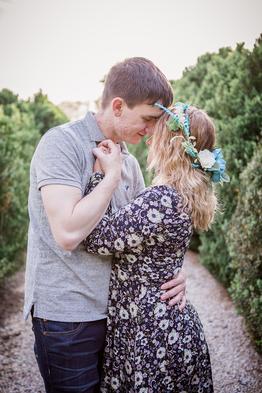 Left hand pulling her lower back close engagement photo by Knoxville Wedding Photographer, Amanda May Photos.