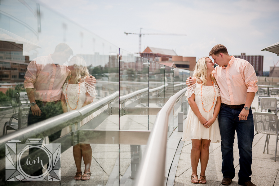 Reflection in the glass engagement photo by Knoxville Wedding Photographer, Amanda May Photos.