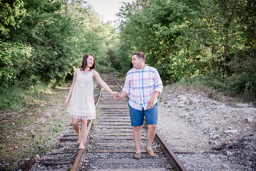 Walking on train tracks engagement photo by Knoxville Wedding Photographer, Amanda May Photos.