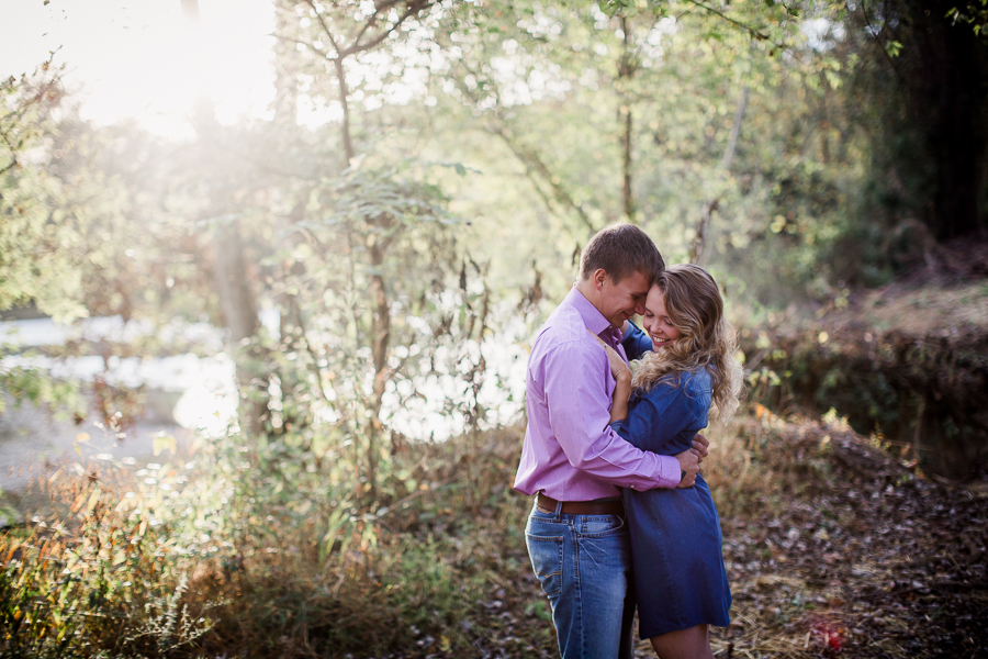 Squeezing her close engagement photo by Knoxville Wedding Photographer, Amanda May Photos.