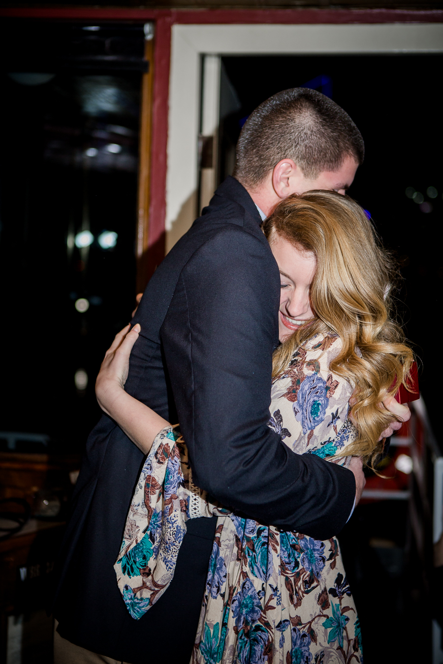 Hugging her after proposing engagement photo by Knoxville Wedding Photographer, Amanda May Photos.