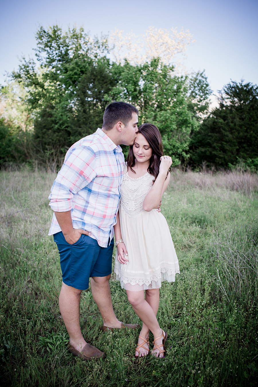 She plays with her hair engagement photo by Knoxville Wedding Photographer, Amanda May Photos.