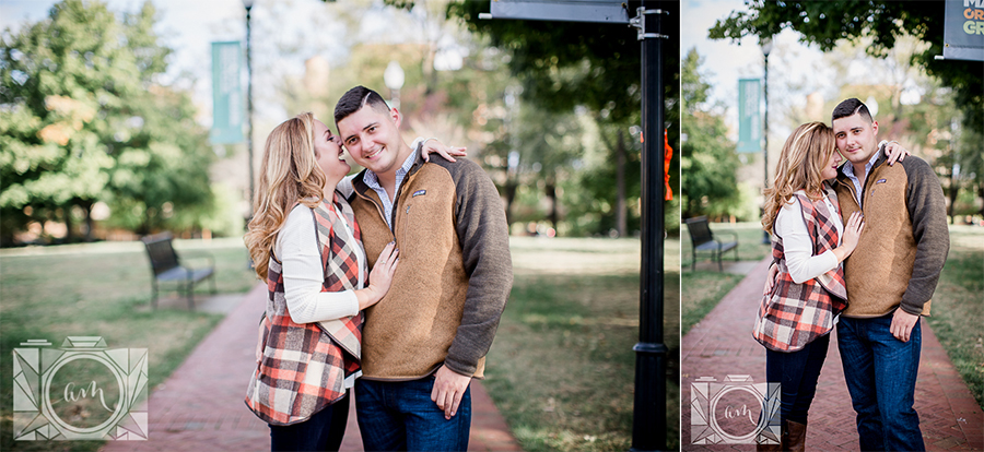 She whispers in his ear engagement photo by Knoxville Wedding Photographer, Amanda May Photos.