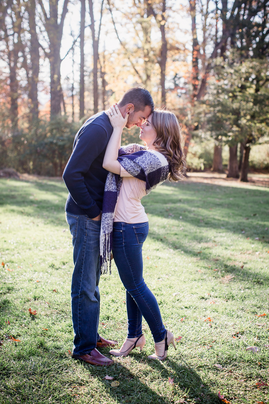Her hands on his cheeks engagement photo by Knoxville Wedding Photographer, Amanda May Photos.