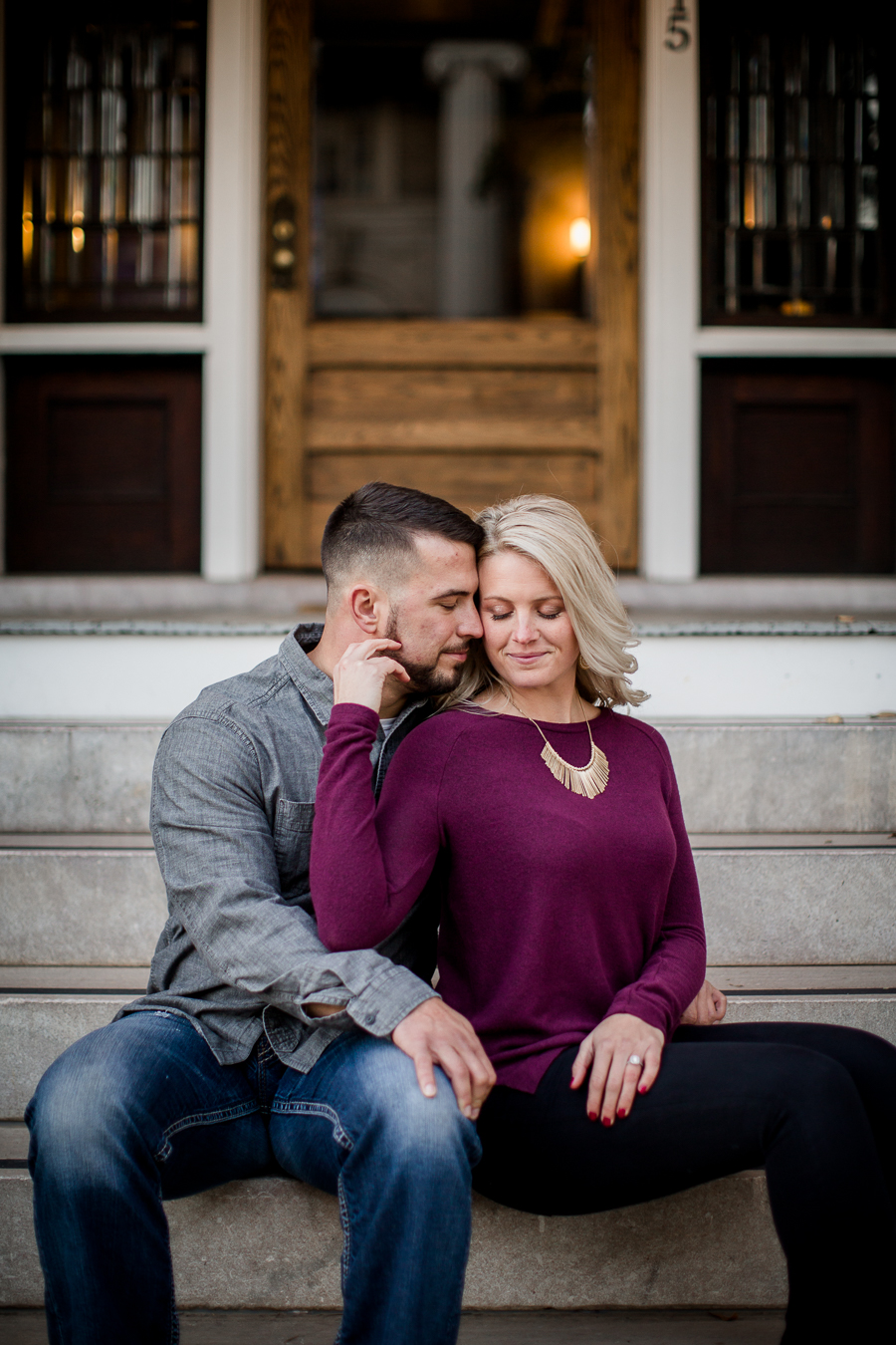 Her hand reached back on his cheek engagement photo by Knoxville Wedding Photographer, Amanda May Photos.