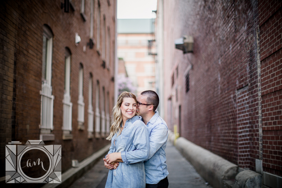 Snuggles in an alley engagement photo by Knoxville Wedding Photographer, Amanda May Photos.