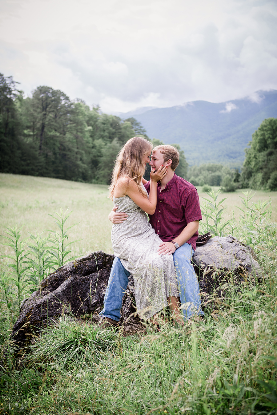She sits on his lap engagement photo by Knoxville Wedding Photographer, Amanda May Photos.