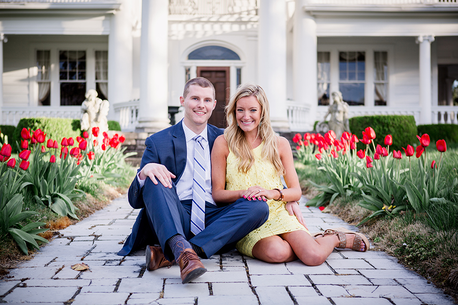 Sitting in middle of tulips engagement photo by Knoxville Wedding Photographer, Amanda May Photos.