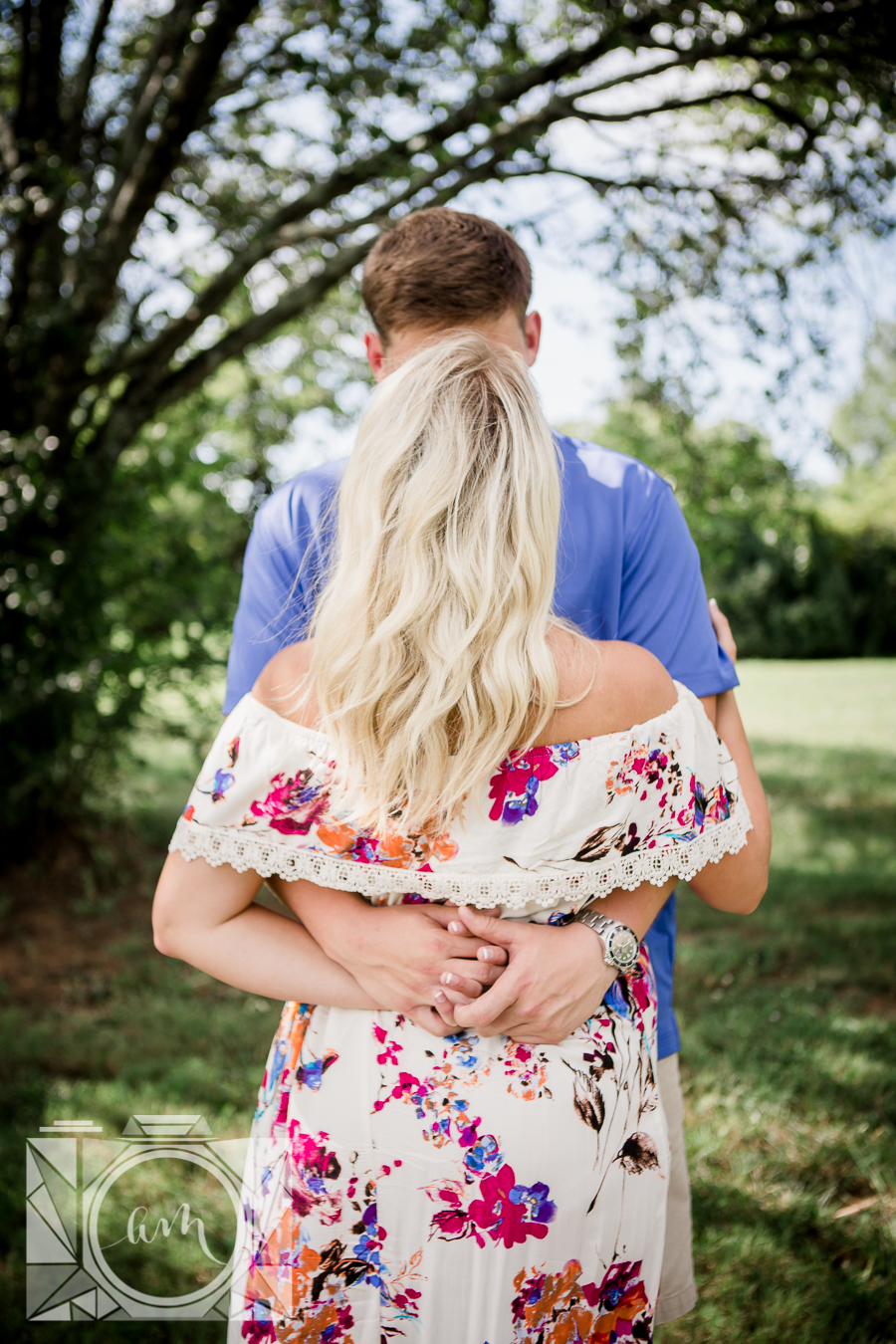 His and her hands tangled behind her back engagement photo by Knoxville Wedding Photographer, Amanda May Photos.