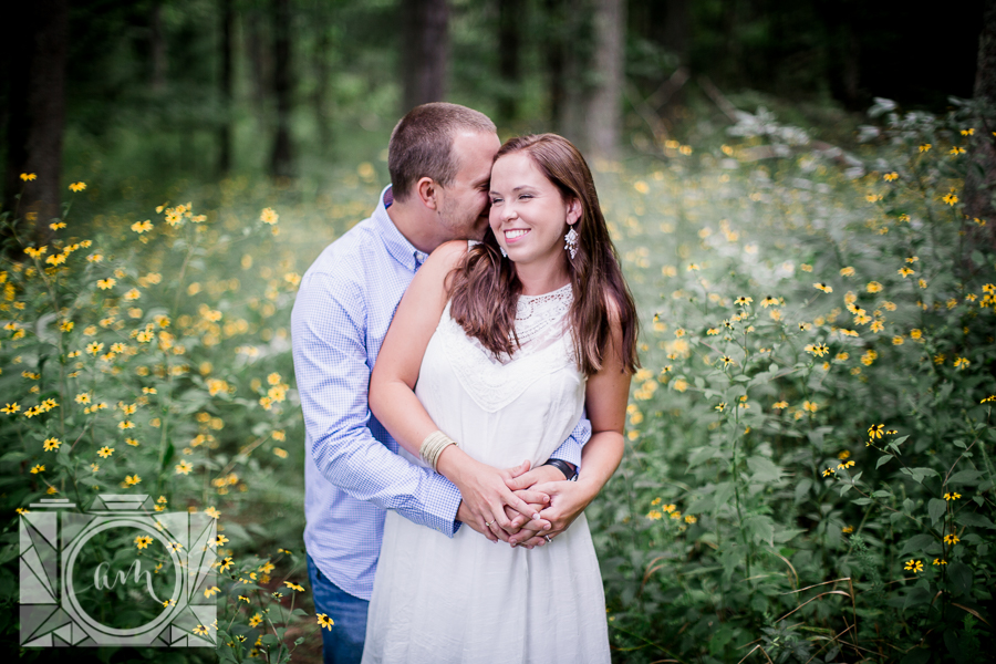 He tickles her neck engagement photo by Knoxville Wedding Photographer, Amanda May Photos.