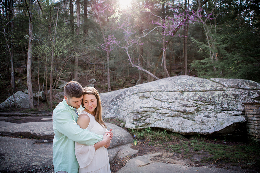Sun coming through trees engagement photo by Knoxville Wedding Photographer, Amanda May Photos.