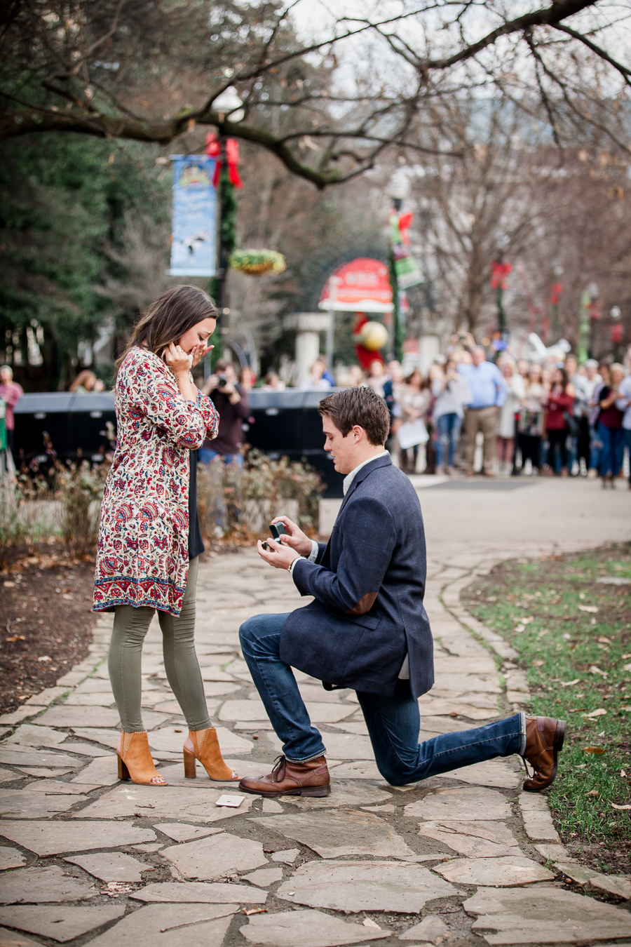 On one knee in market square engagement photo by Knoxville Wedding Photographer, Amanda May Photos.