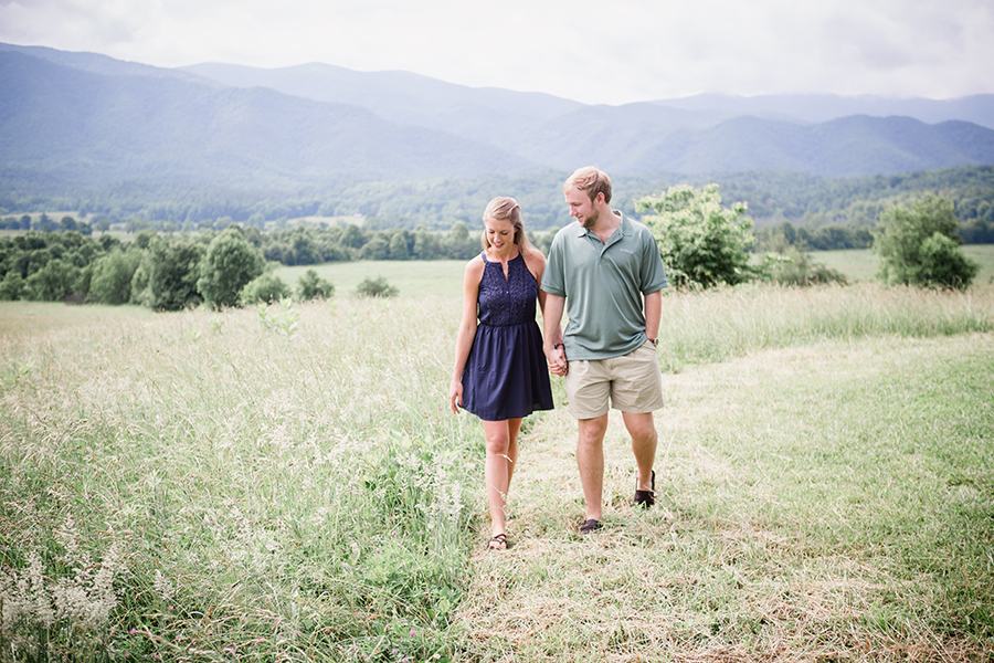 Walking in cades cove engagement photo by Knoxville Wedding Photographer, Amanda May Photos.