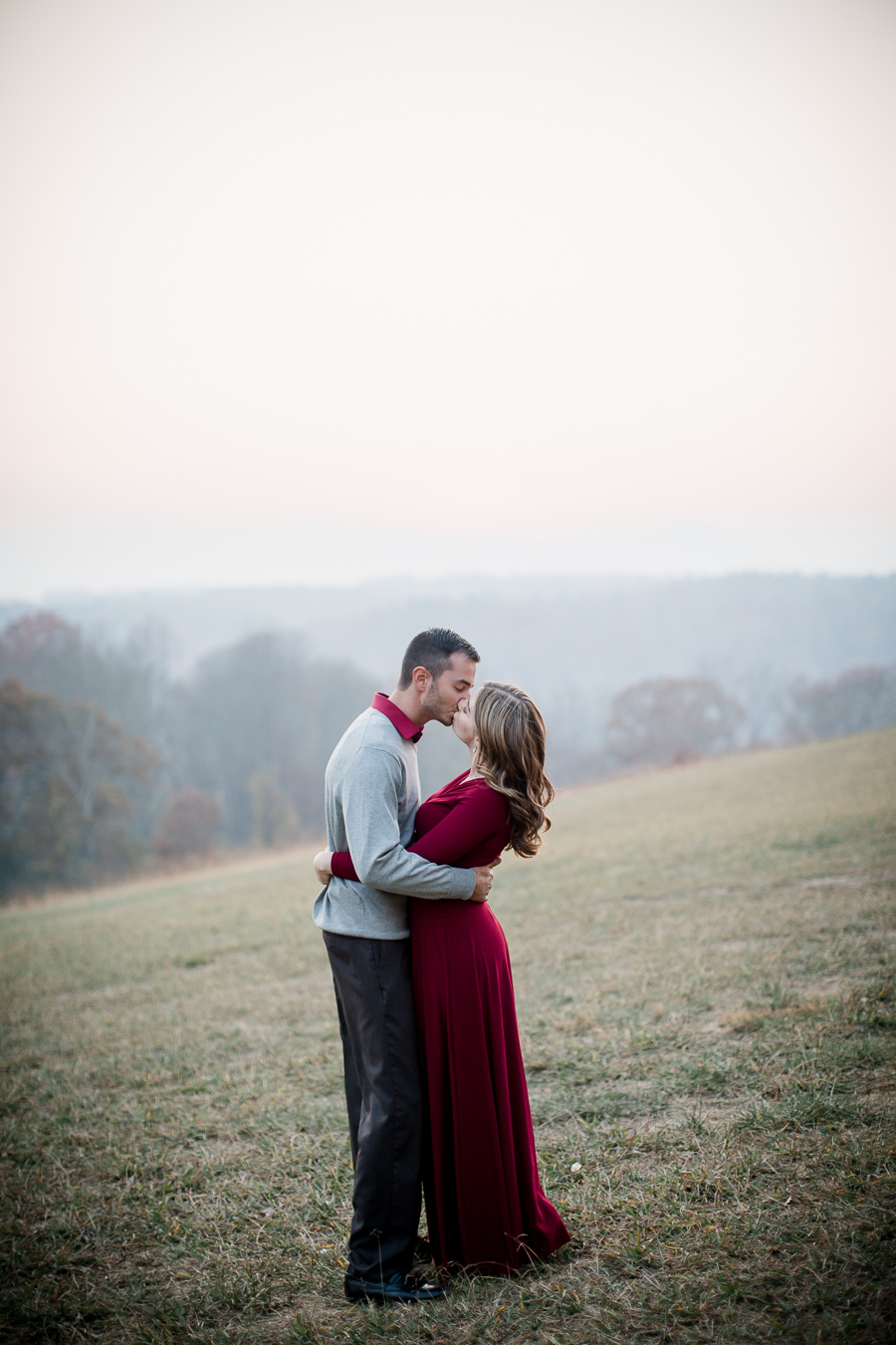 Kissing in the fog engagement photo by Knoxville Wedding Photographer, Amanda May Photos.