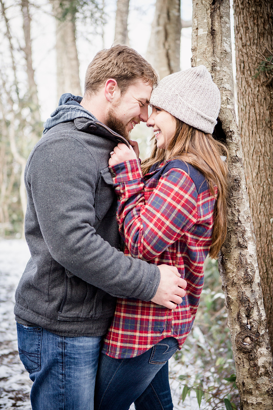 She pulls his jacket in engagement photo by Knoxville Wedding Photographer, Amanda May Photos.