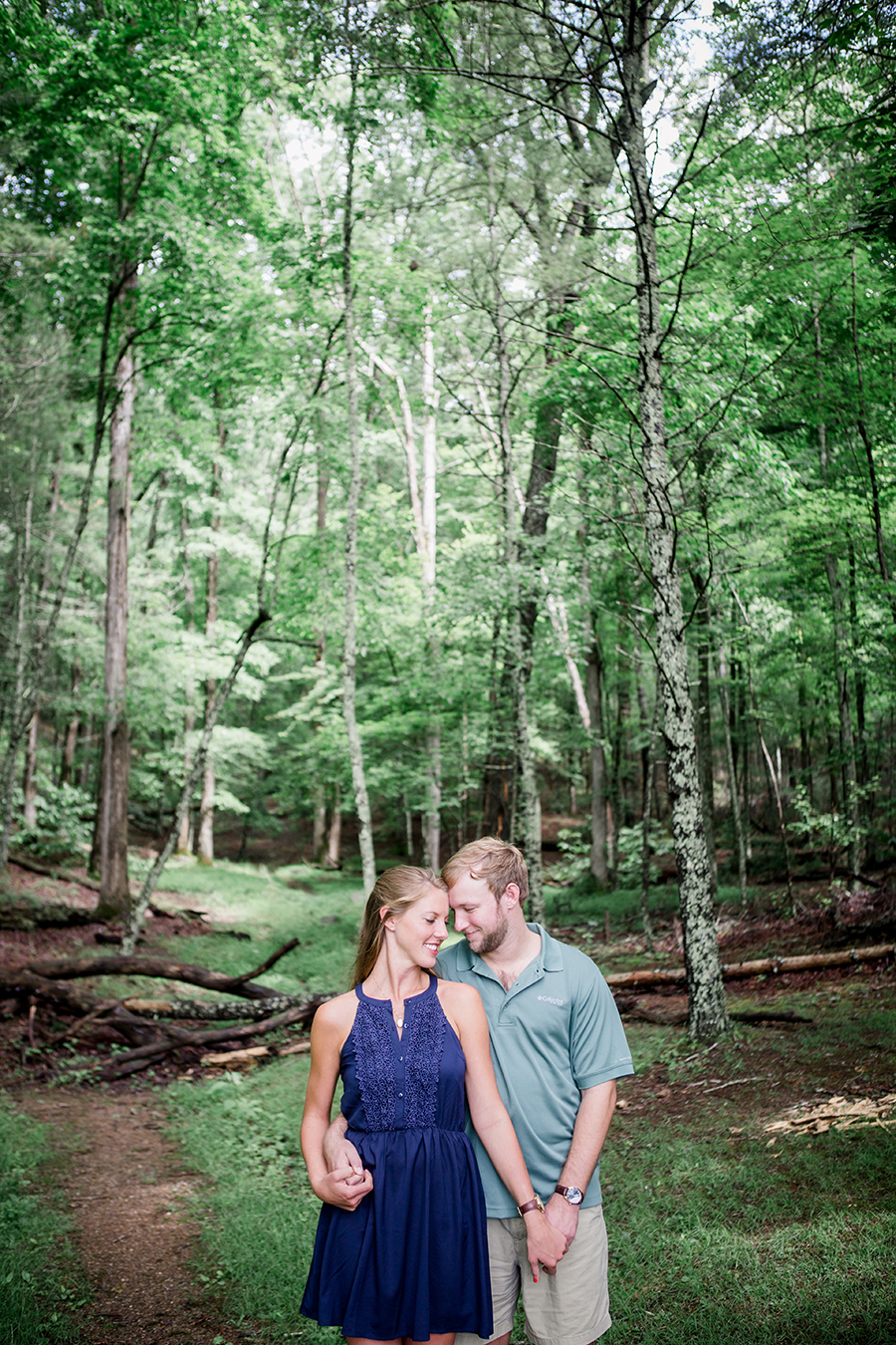 Foreheads together in the forest engagement photo by Knoxville Wedding Photographer, Amanda May Photos.