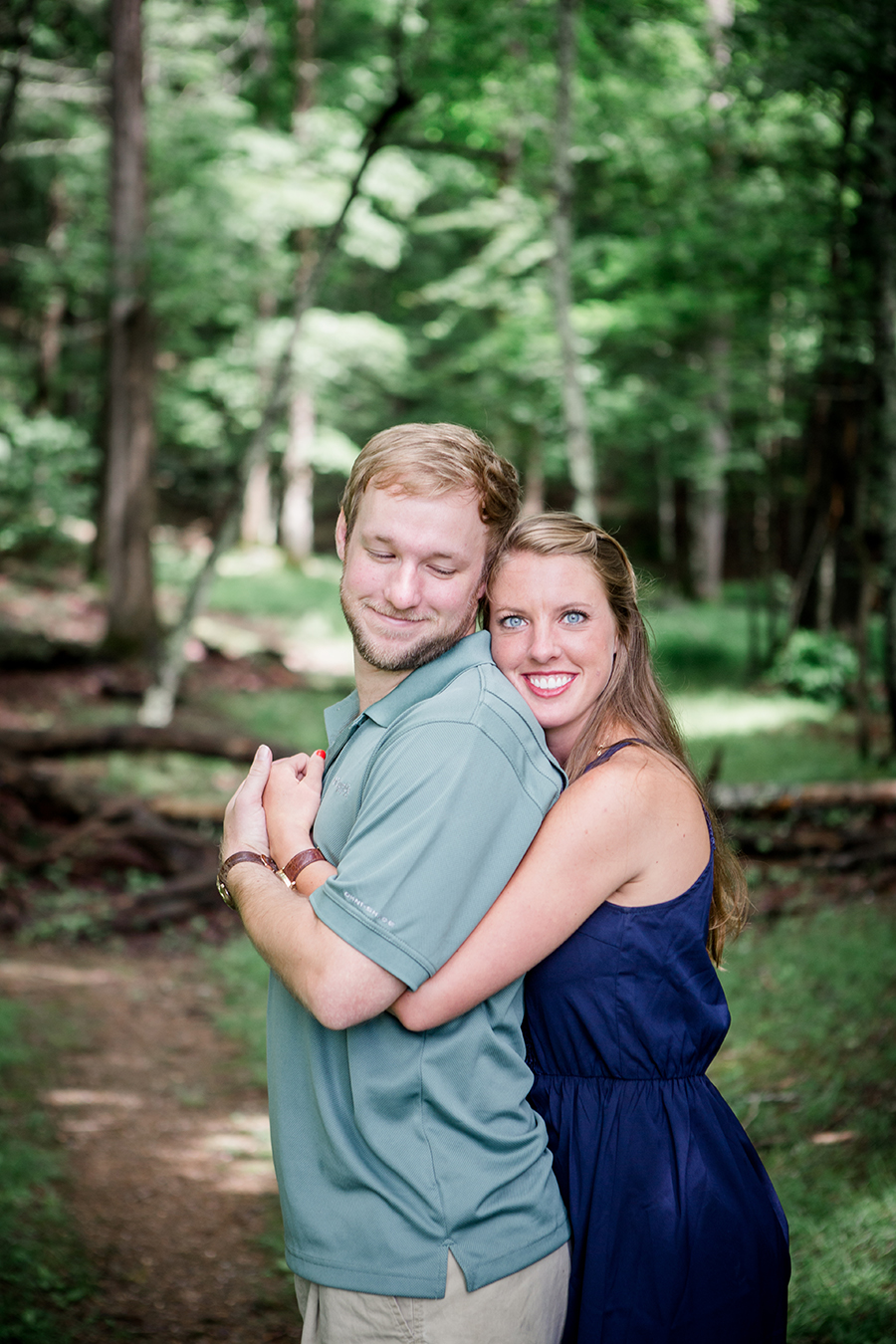Her head against the back of his neck engagement photo by Knoxville Wedding Photographer, Amanda May Photos.