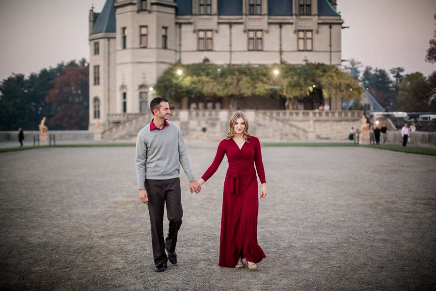 Walking in front of biltmore engagement photo by Knoxville Wedding Photographer, Amanda May Photos.