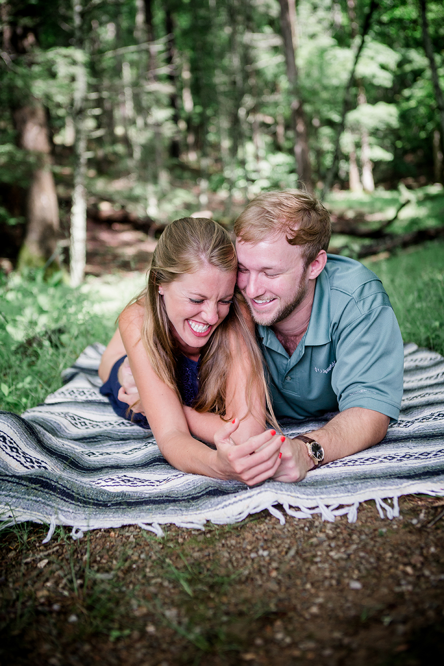 On stomachs tickling her engagement photo by Knoxville Wedding Photographer, Amanda May Photos.