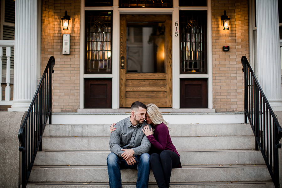 Sitting on steps in golden lighting engagement photo by Knoxville Wedding Photographer, Amanda May Photos.