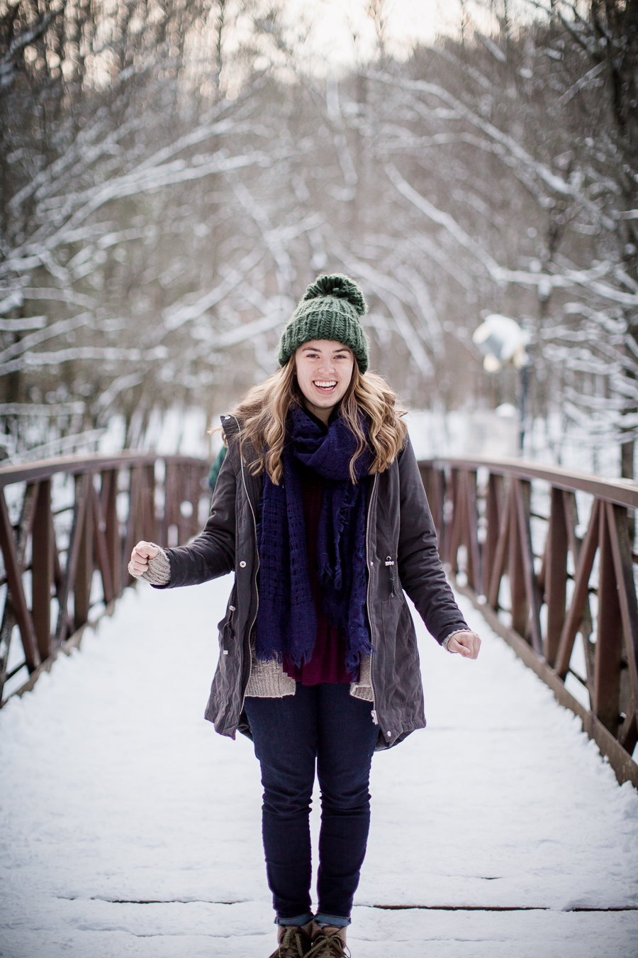 Standing on a snowy bridge by Knoxville Wedding Photographer, Amanda May Photos.