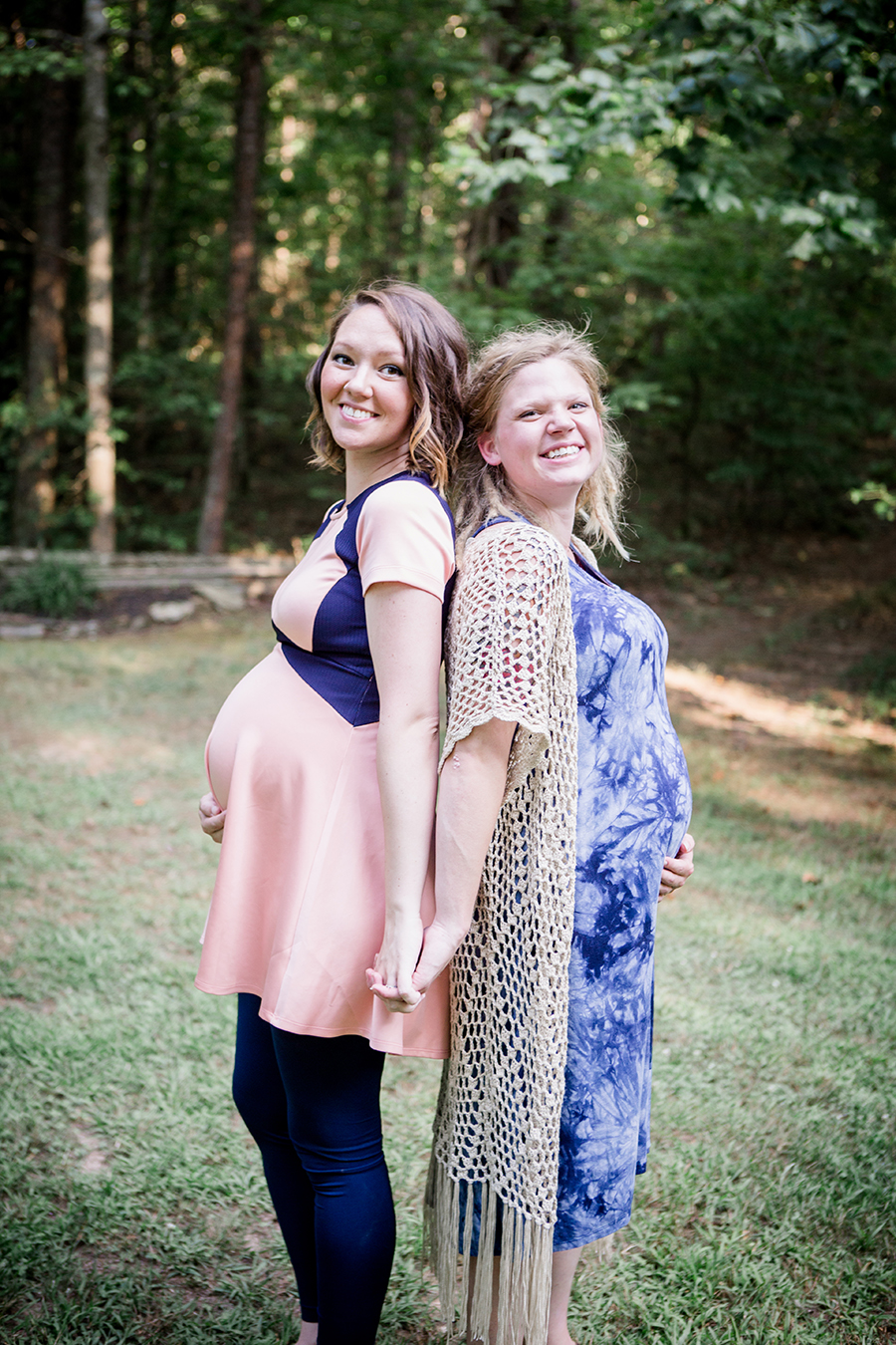 Pregnant sisters back to back by Knoxville Wedding Photographer, Amanda May Photos.