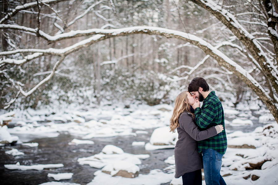 Kissing in the snow by Knoxville Wedding Photographer, Amanda May Photos.