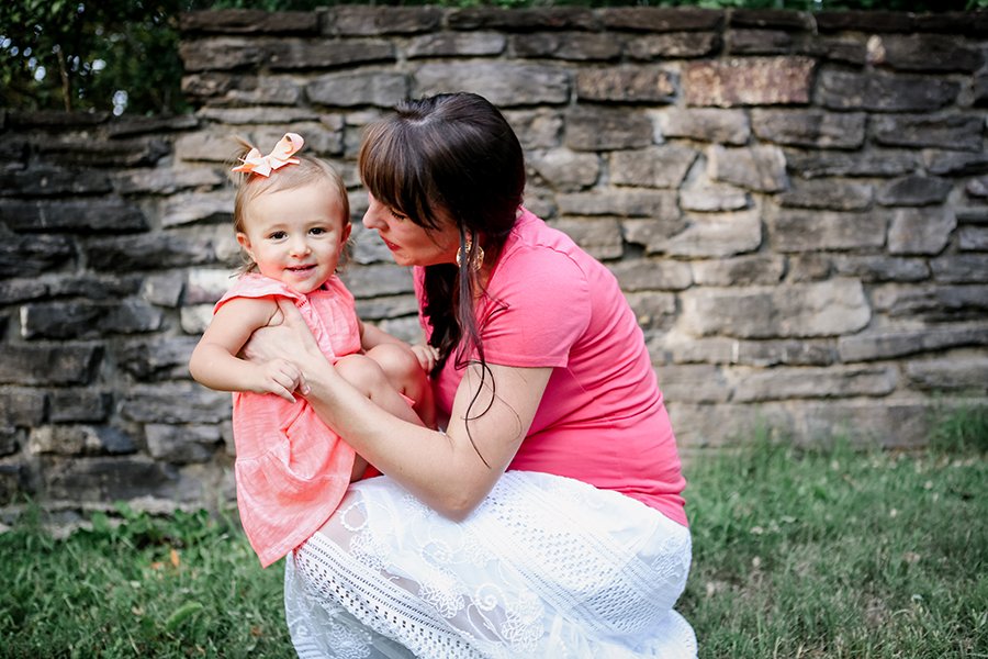 Mom squatting with daughter on her lap by Knoxville Wedding Photographer, Amanda May Photos.