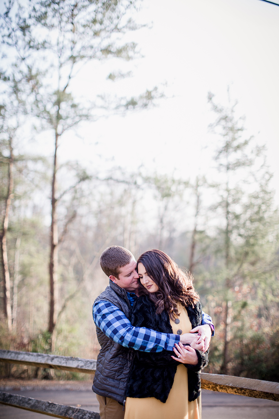 Hugging her from behind by Knoxville Wedding Photographer, Amanda May Photos.