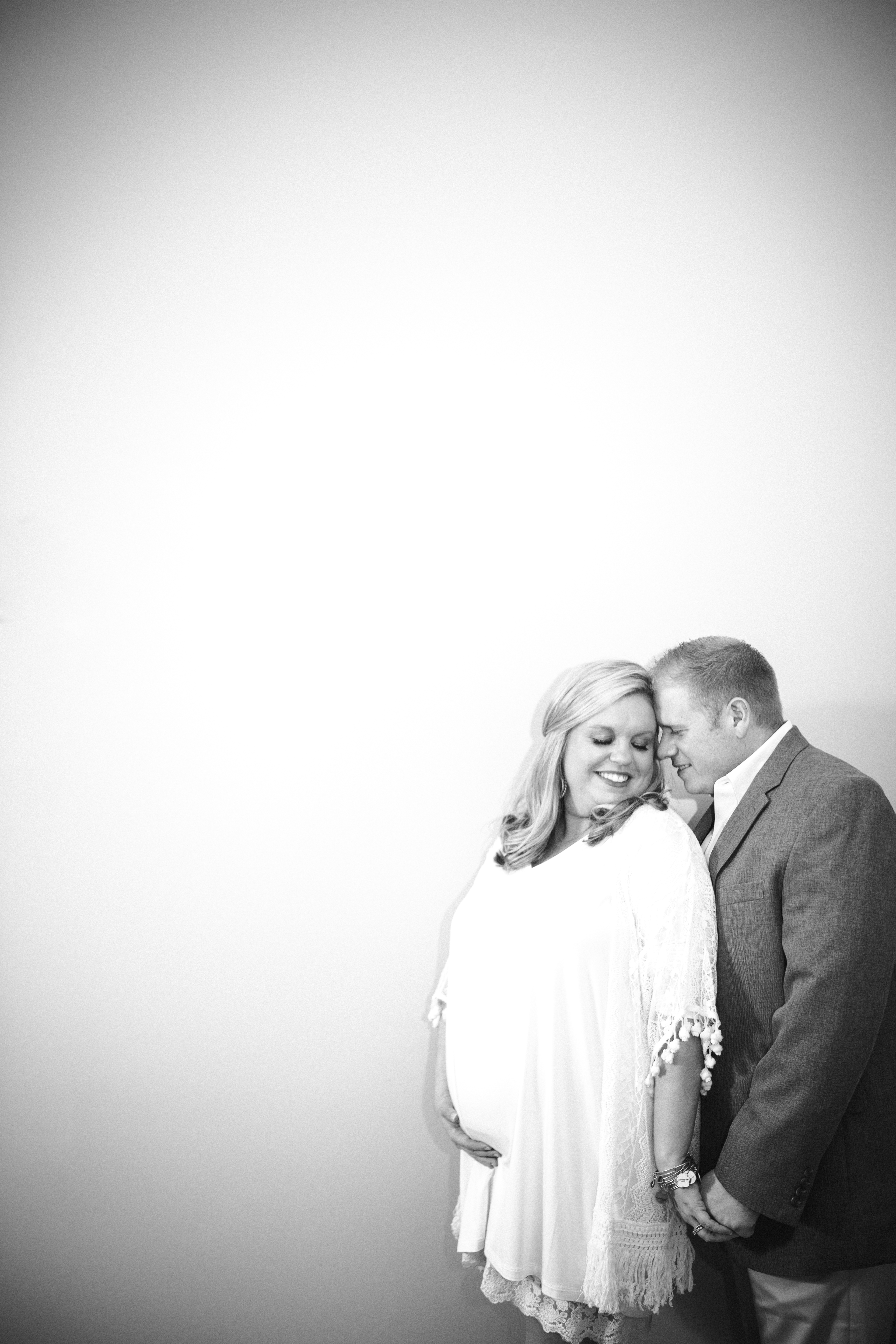 Black and white against a blank wall by Knoxville Wedding Photographer, Amanda May Photos.