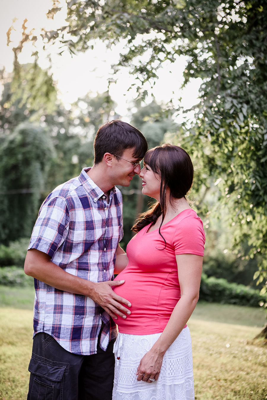Maternity dad's hand on baby bump by Knoxville Wedding Photographer, Amanda May Photos.