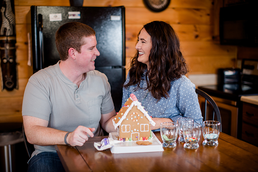 Laughing at gingerbread house by Knoxville Wedding Photographer, Amanda May Photos.